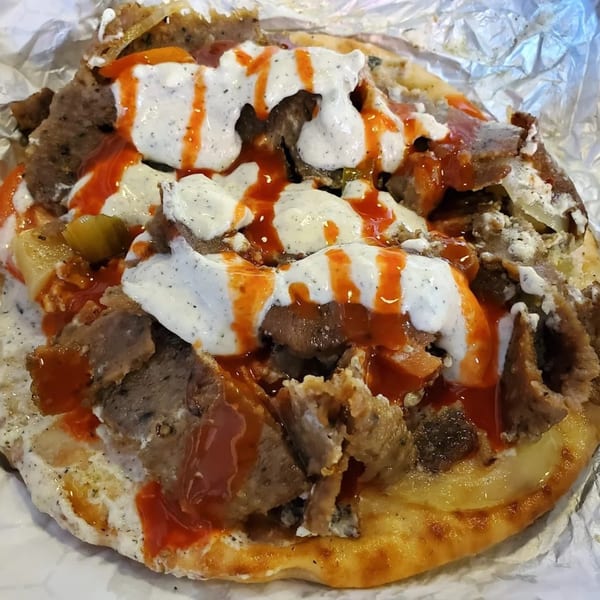 King Of Gyros' gyro meat and sauce on pita bread, wrapped in foil.